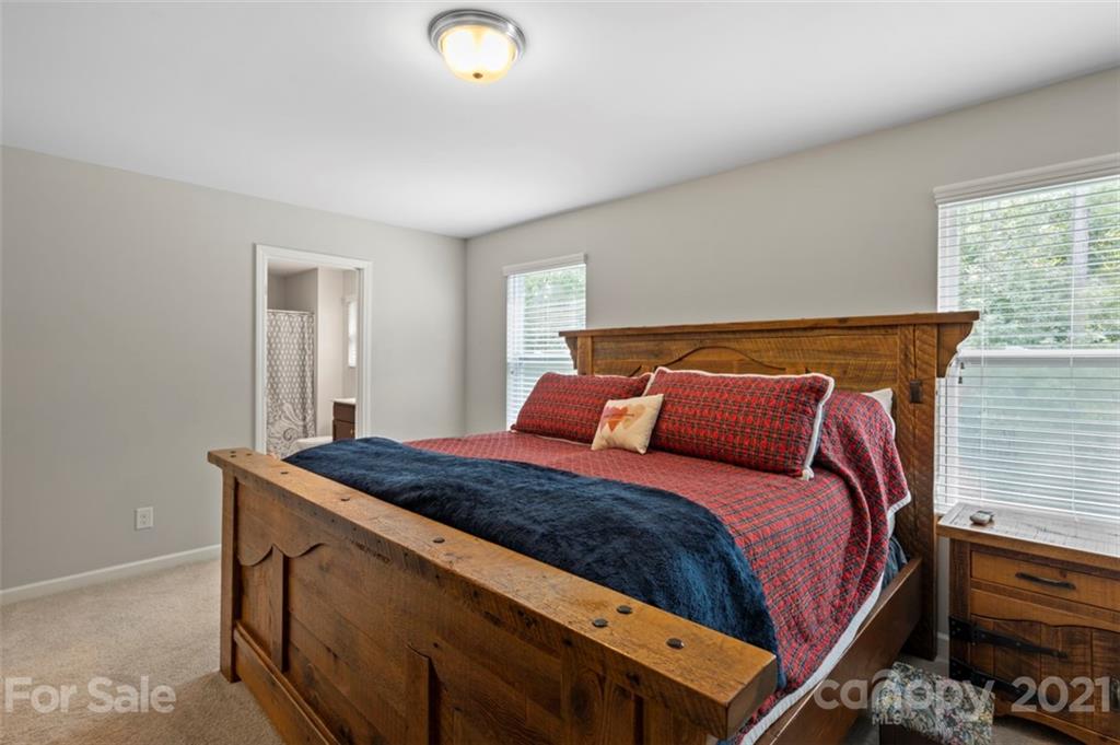 112 Tranquil Court Locust, NC 28097 - Photo 15 of 25 a bedroom with a bed and window
