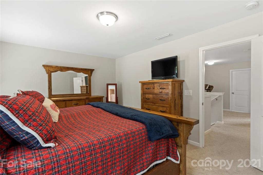 112 Tranquil Court Locust, NC 28097 - Photo 16 of 25 a bedroom with a bed and a television