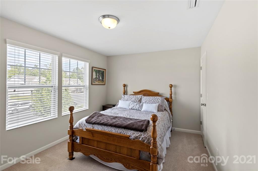 112 Tranquil Court Locust, NC 28097 - Photo 19 of 25 a bedroom with a bed and a window
