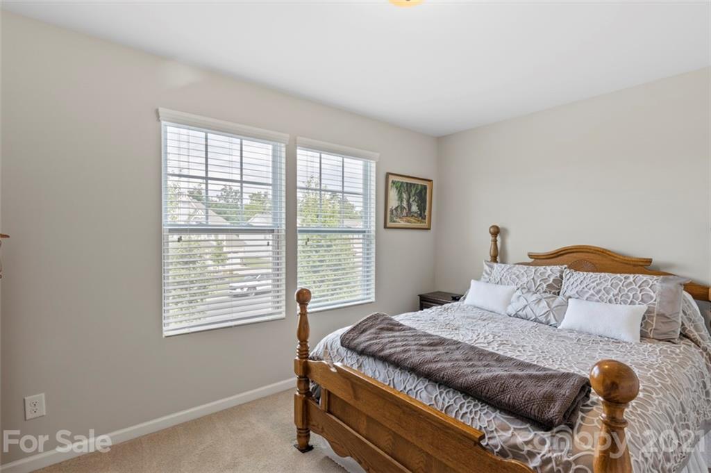 112 Tranquil Court Locust, NC 28097 - Photo 20 of 25 a bedroom with a bed and window