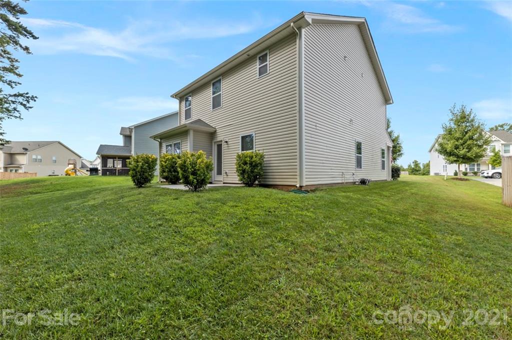 112 Tranquil Court Locust, NC 28097 - Photo 23 of 25 a front view of a house with garden