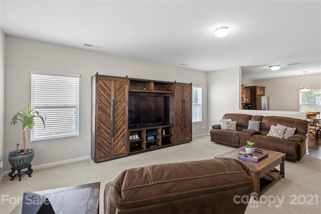 112 Tranquil Court Locust, NC 28097 - Photo 5 of 25 a bedroom with furniture and a flat screen tv