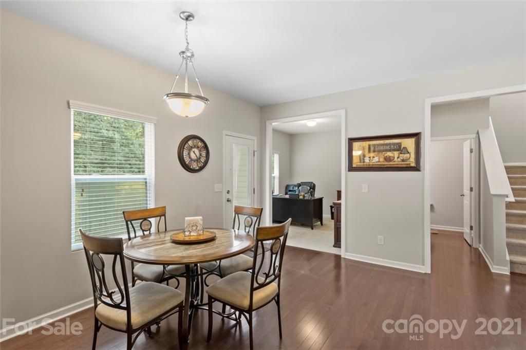 112 Tranquil Court Locust, NC 28097 - Photo 9 of 25 a view of a dining room with furniture and wooden floor
