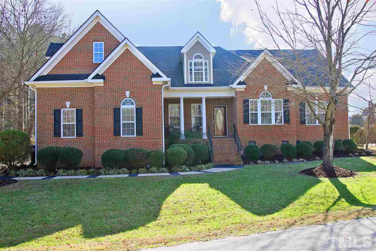 844 Oxen Circle Raleigh, NC 27603 - Photo 1 of 30 a front view of a house with garden