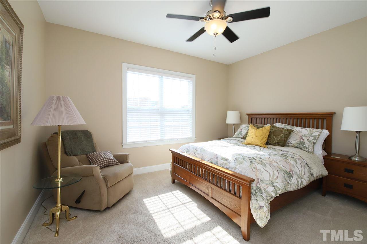 844 Oxen Circle Raleigh, NC 27603 - Photo 14 of 30 a bedroom with a bed couch and window