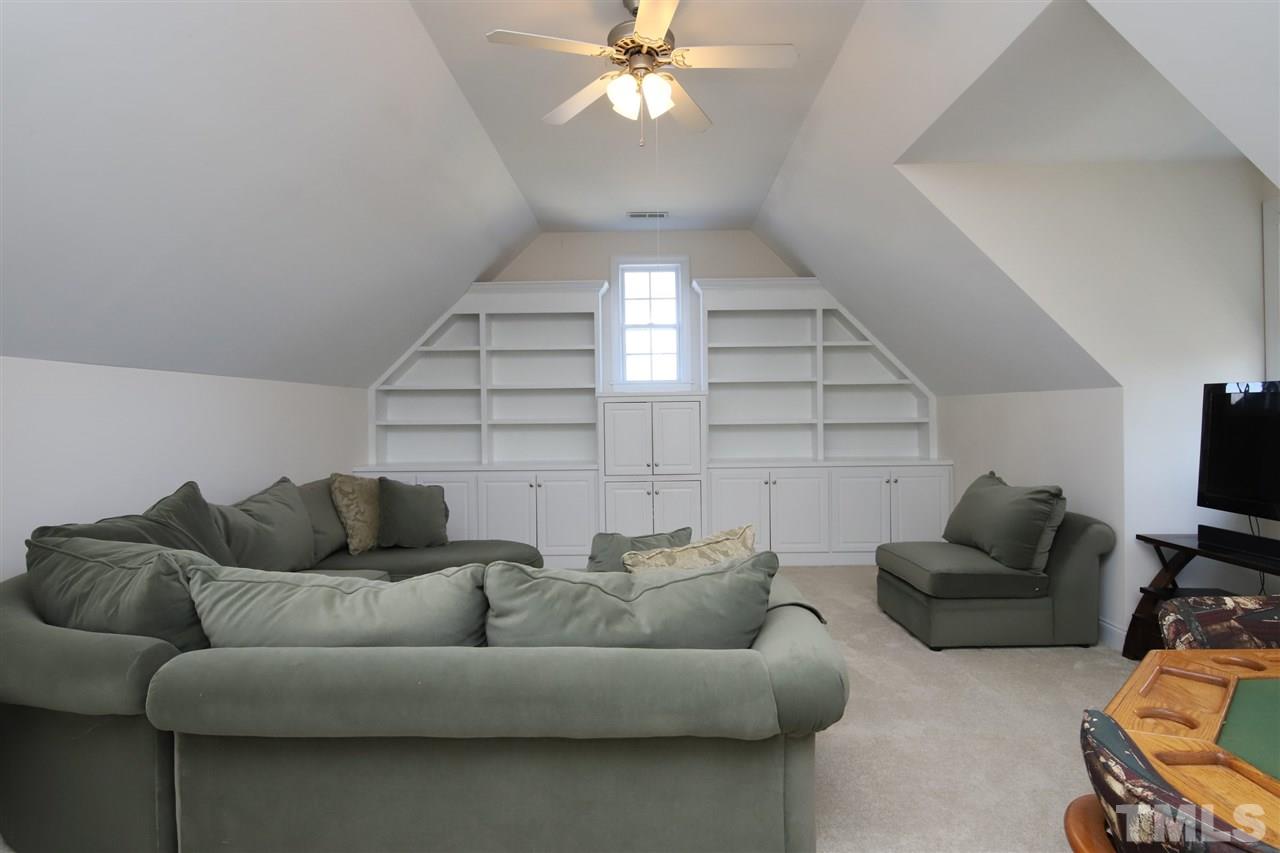 844 Oxen Circle Raleigh, NC 27603 - Photo 16 of 30 a living room with furniture and a flat screen tv