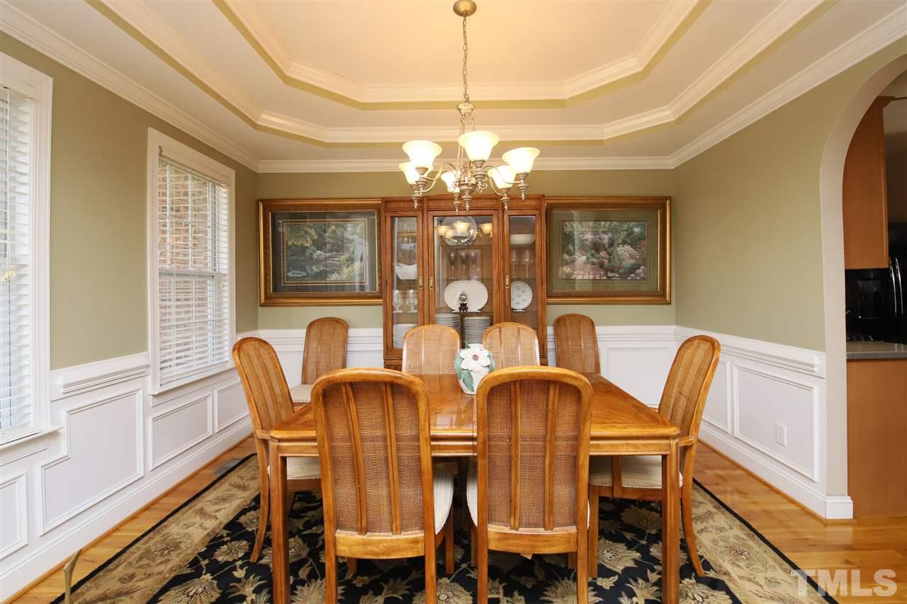 844 Oxen Circle Raleigh, NC 27603 - Photo 3 of 30 a view of a dining room with furniture and chandelier