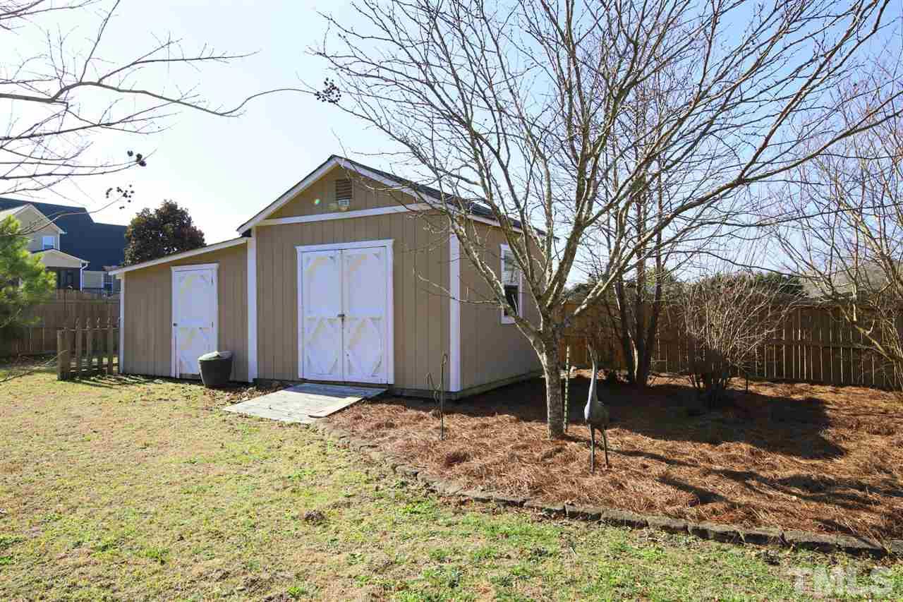 844 Oxen Circle Raleigh, NC 27603 - Photo 21 of 30 a view of a house with a yard covered with snow