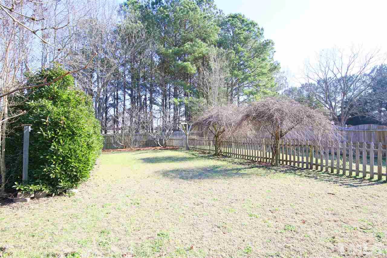 844 Oxen Circle Raleigh, NC 27603 - Photo 22 of 30 a view of backyard with wooden fence