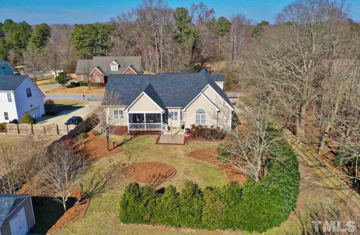 844 Oxen Circle Raleigh, NC 27603 - Photo 27 of 30 a view of house with backyard and trees