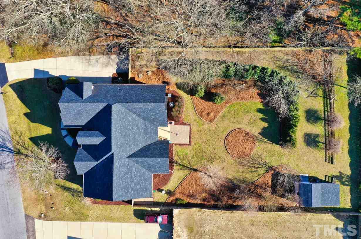 844 Oxen Circle Raleigh, NC 27603 - Photo 29 of 30 an aerial view of a house with swimming pool and large trees