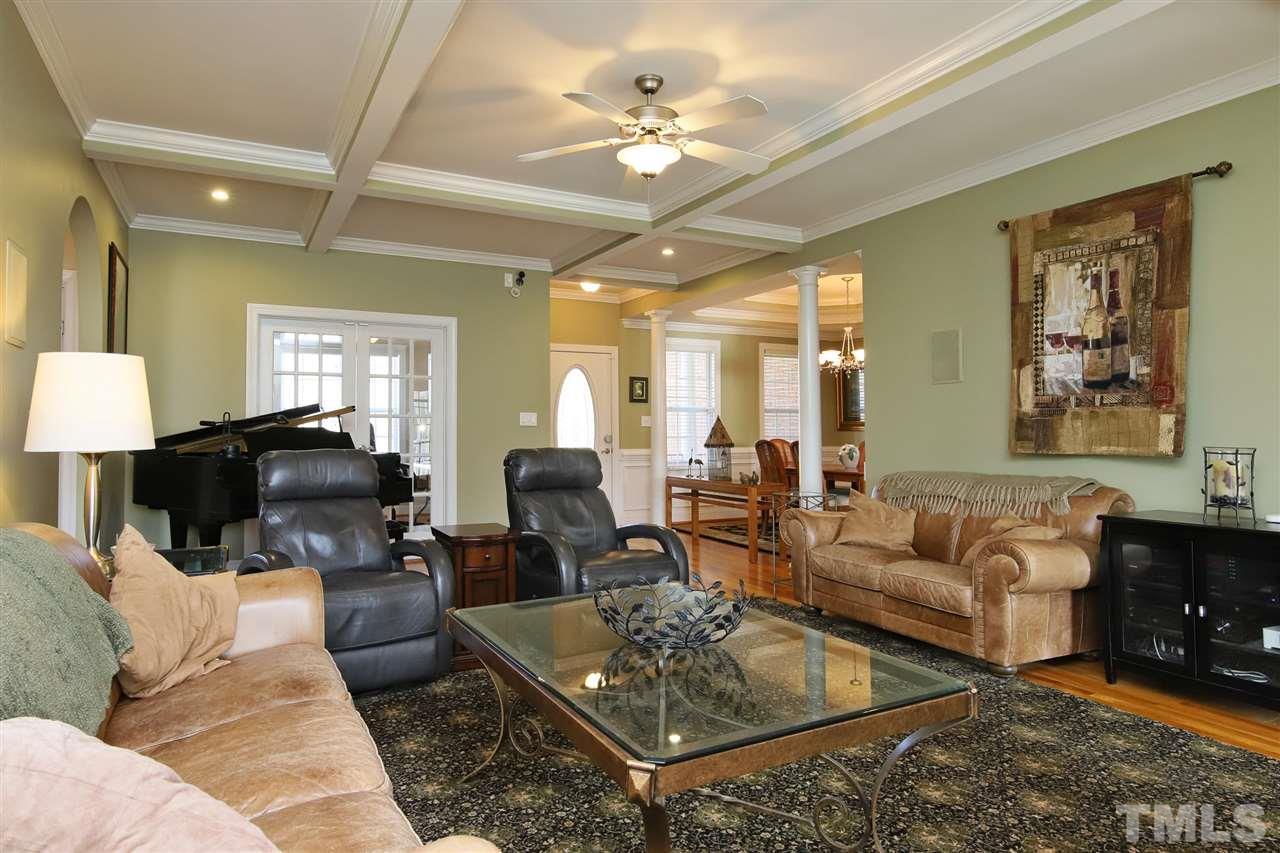 844 Oxen Circle Raleigh, NC 27603 - Photo 4 of 30 a living room with furniture ceiling fan and a rug
