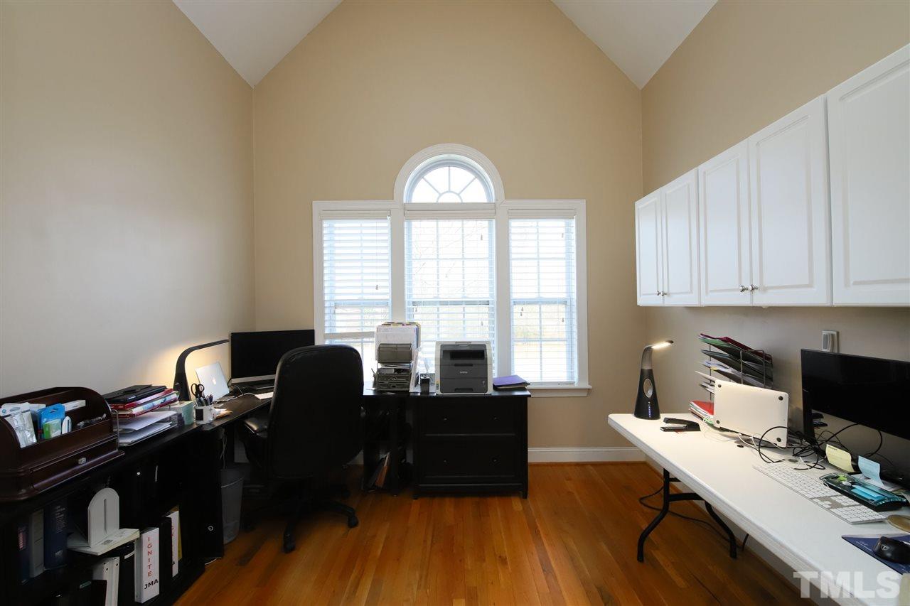 844 Oxen Circle Raleigh, NC 27603 - Photo 6 of 30 a view of a workspace with furniture and a window