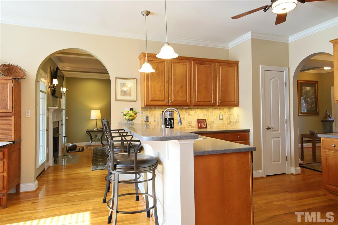 844 Oxen Circle Raleigh, NC 27603 - Photo 8 of 30 a kitchen with sink refrigerator and cabinets