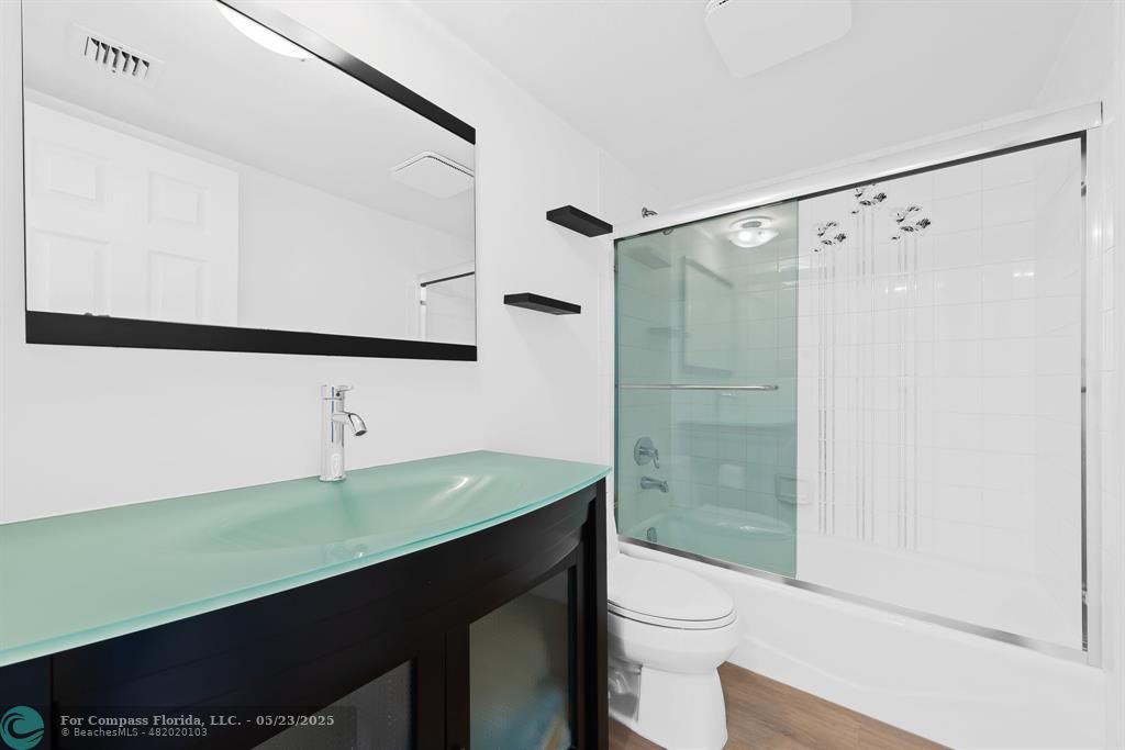1100 Southeast 5th Court, Unit 33 Pompano Beach, FL 33060 - Photo 15 of 26 a bathroom with a sink a toilet and shower