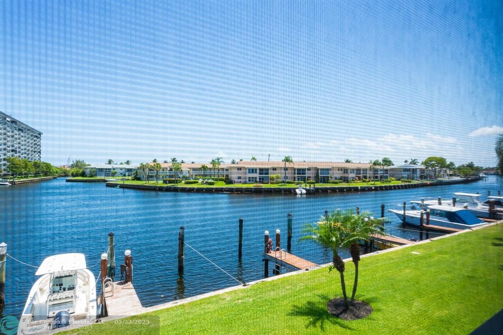 1100 Southeast 5th Court, Unit 33 Pompano Beach, FL 33060 - Photo 16 of 26 a view of a lake from a balcony
