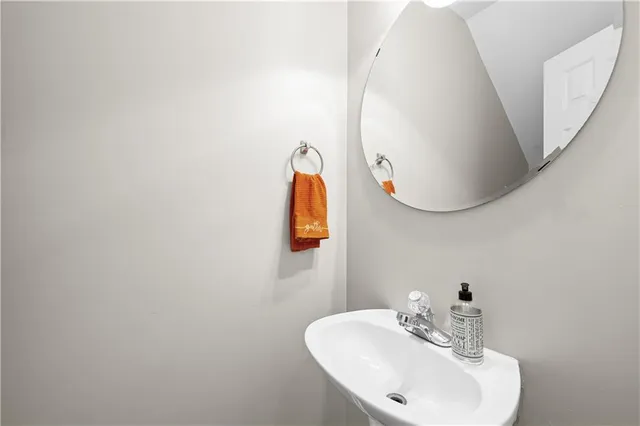 a bathroom with a sink and mirror