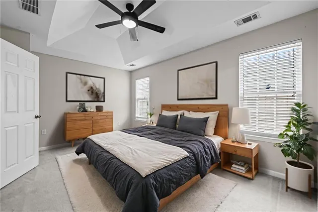 a bedroom with a bed and window