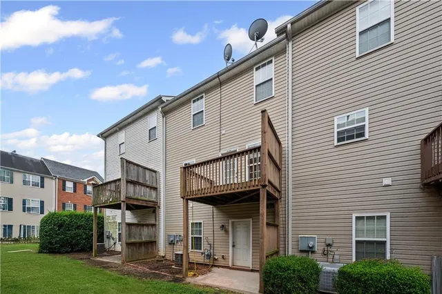 a view of a white building among the street