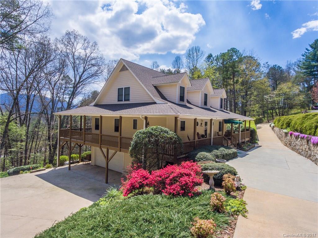 501 Oak Ridge Drive Clyde, NC 28721 - Photo 1 of 24 a front view of a house with garden