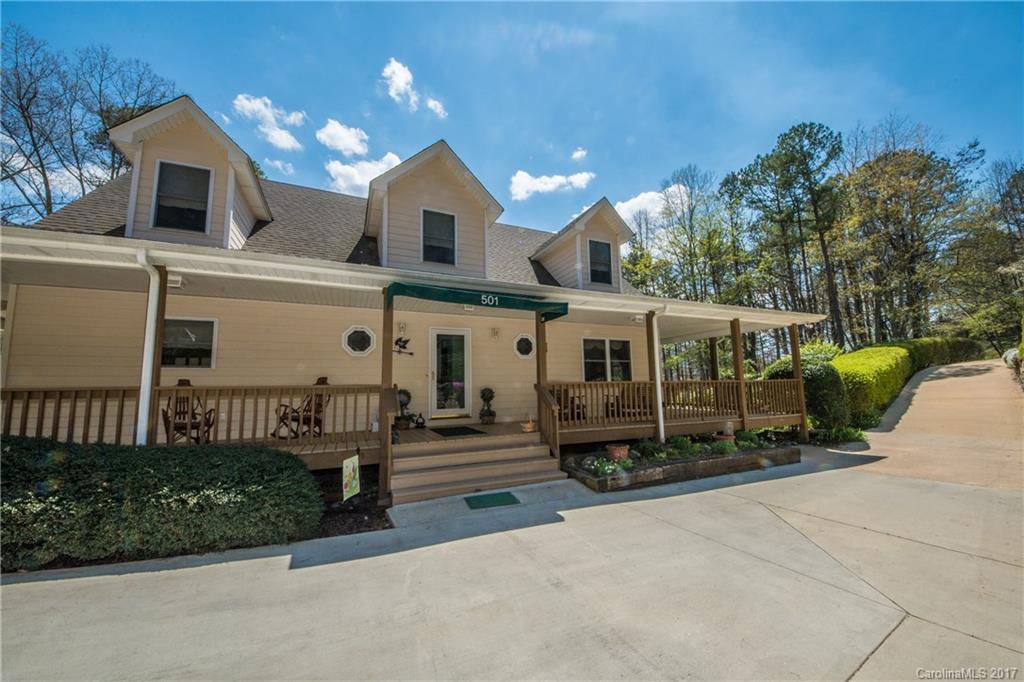 501 Oak Ridge Drive Clyde, NC 28721 - Photo 2 of 24 a front view of a house with a garden