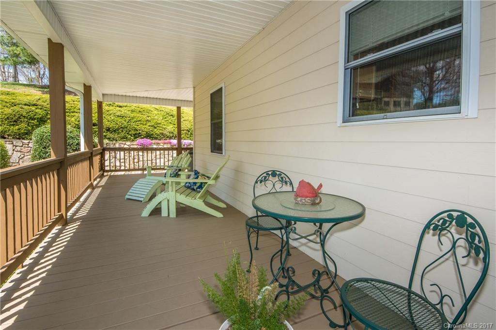 501 Oak Ridge Drive Clyde, NC 28721 - Photo 23 of 24 a table and chairs in a balcony