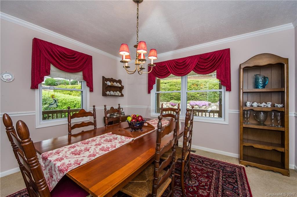 501 Oak Ridge Drive Clyde, NC 28721 - Photo 9 of 24 a view of a dining room with furniture window and outside view