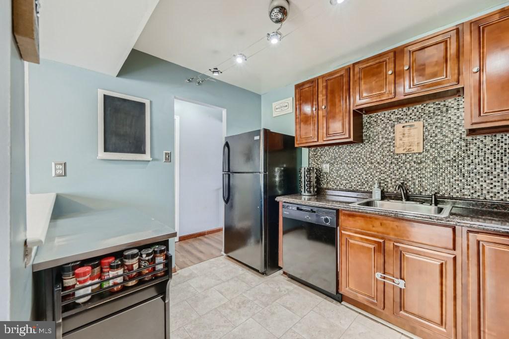 9616 Baron Place, Unit 9616 Rosedale, MD 21237 - Photo 14 of 34 Sold wood cabinets, mosaic tile backsplash