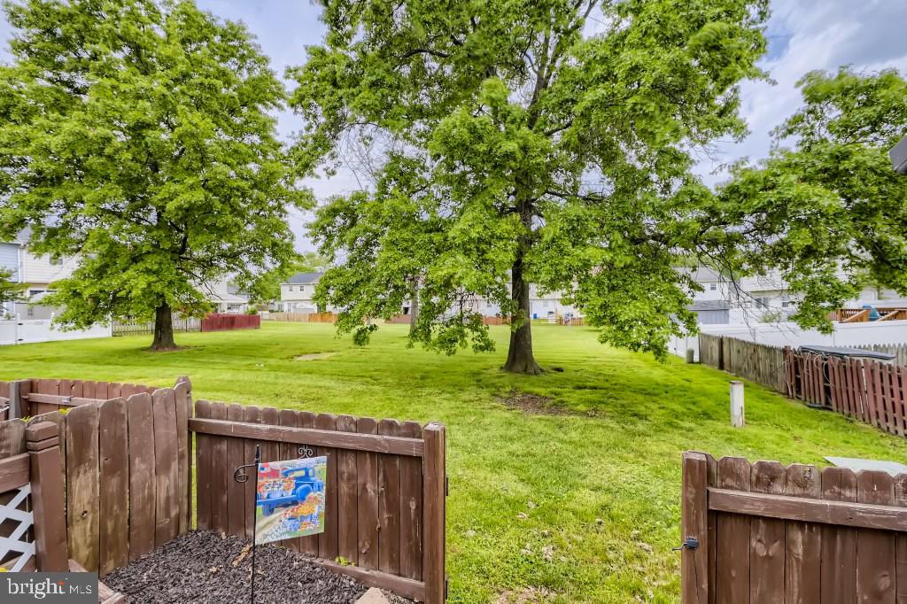 9616 Baron Place, Unit 9616 Rosedale, MD 21237 - Photo 29 of 34 The rear yard backs up to common area grounds