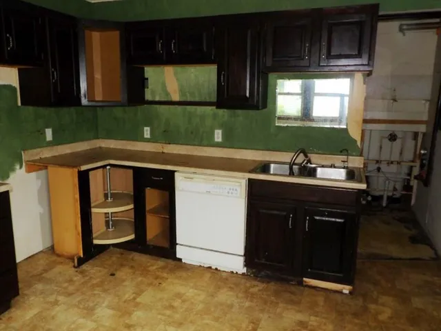 a kitchen with a sink and cabinets