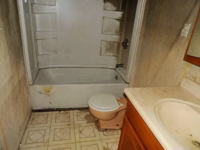 a bathroom with a sink and toilet