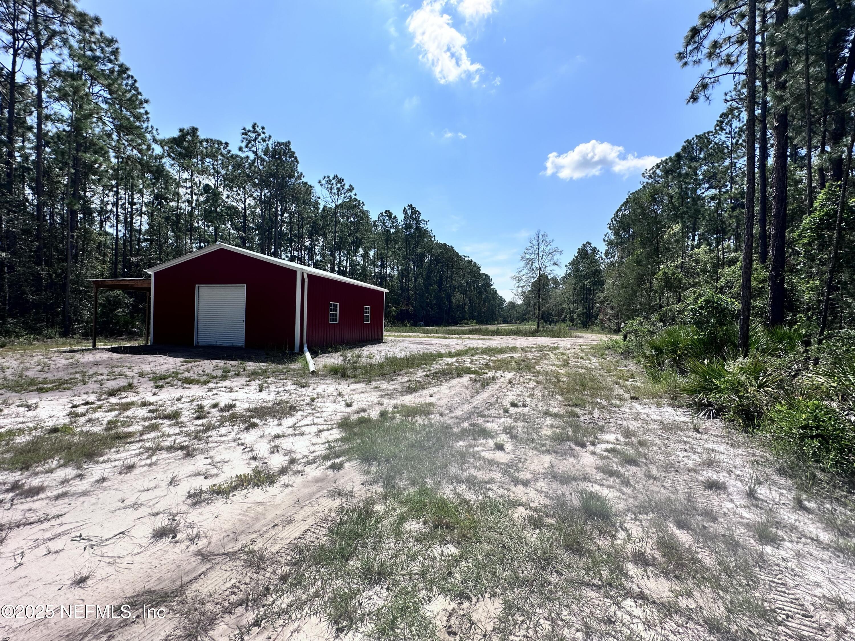 3269 Lannie Road Jacksonville, FL 32218 - Photo 7 of 7 a view of a house with a backyard