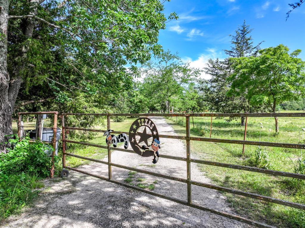 211 Rs County Road 1455 Point, TX 75472 - Photo 11 of 40 a view of a bench in the garden