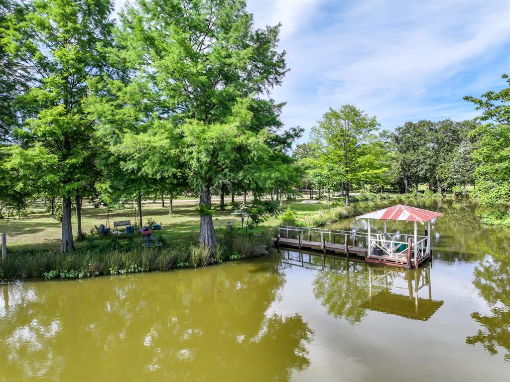 211 Rs County Road 1455 Point, TX 75472 - Photo 14 of 40 a view of a swimming pool with an outdoor seating and a yard