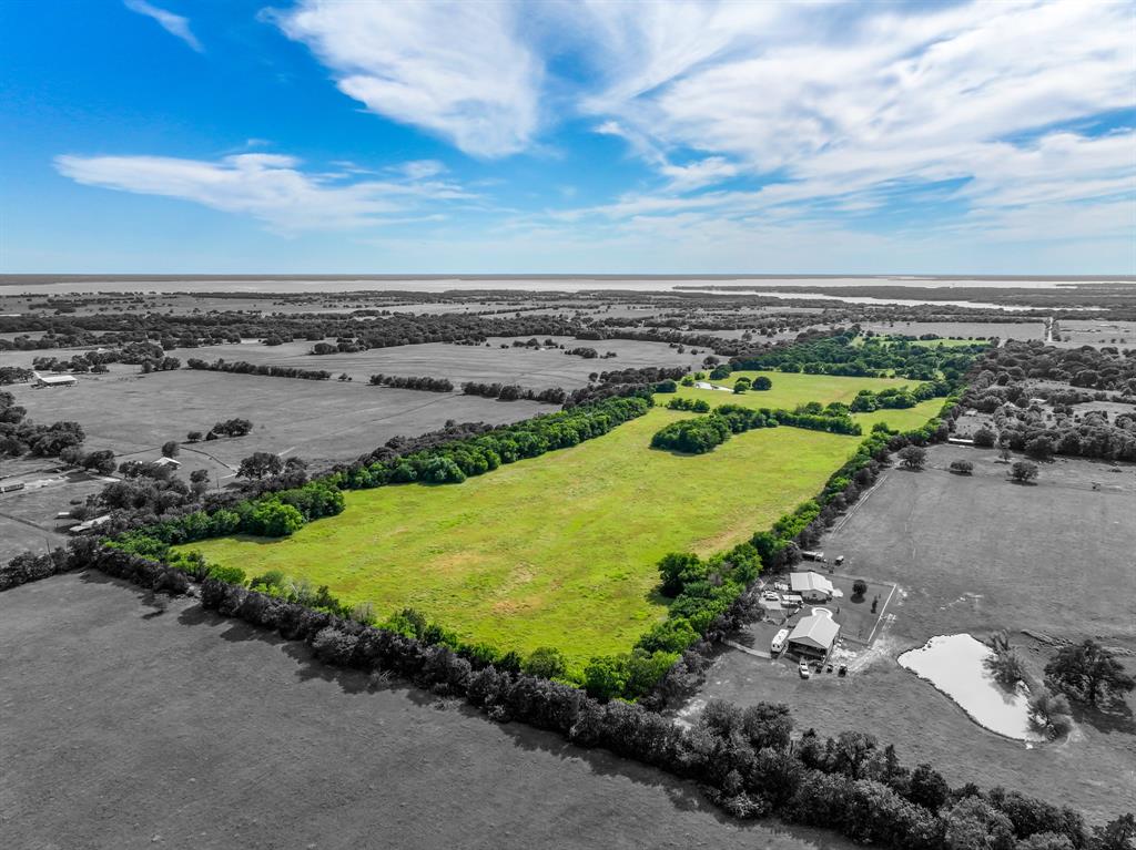 211 Rs County Road 1455 Point, TX 75472 - Photo 2 of 40 a view of a lake with outdoor space