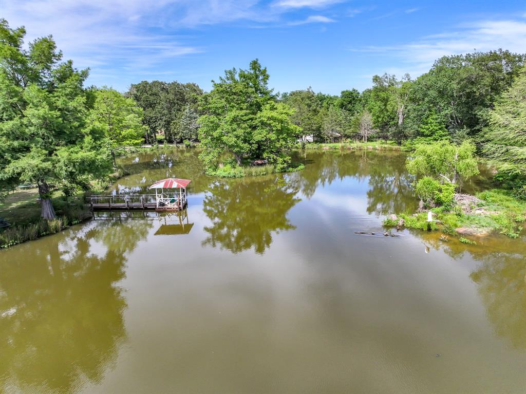 211 Rs County Road 1455 Point, TX 75472 - Photo 22 of 40 a view of a lake view with houses in back