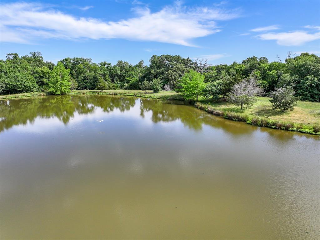 211 Rs County Road 1455 Point, TX 75472 - Photo 23 of 40 a view of a lake with houses in the back