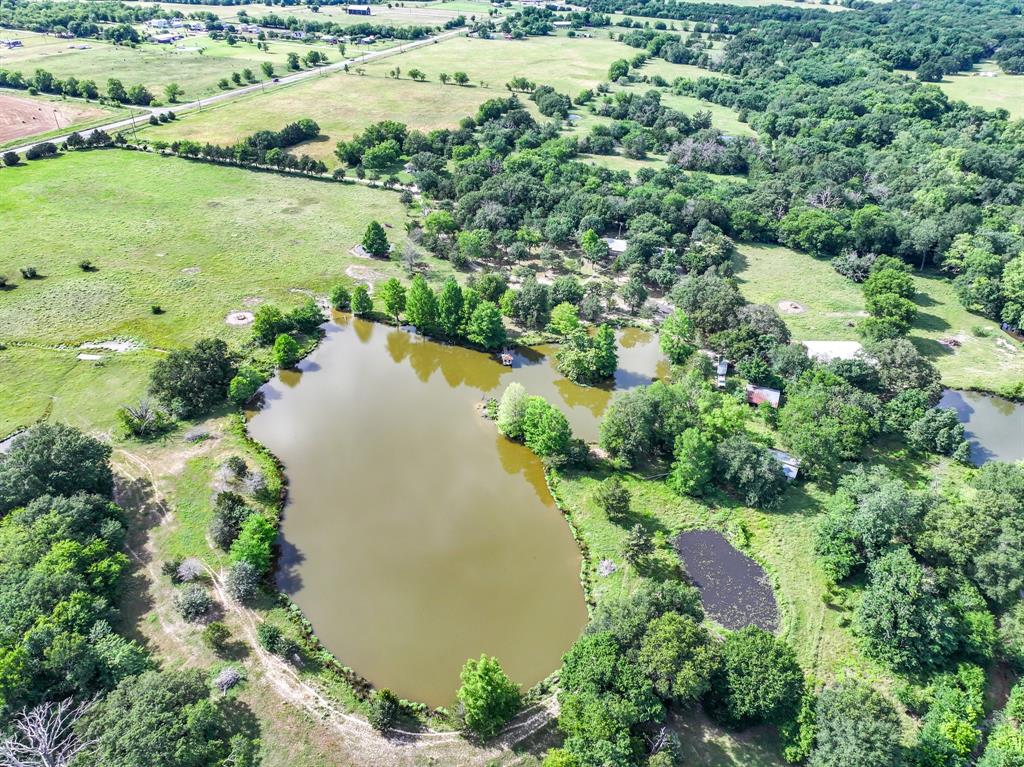 211 Rs County Road 1455 Point, TX 75472 - Photo 32 of 40 an aerial view of ocean with residential houses with outdoor space and trees all around