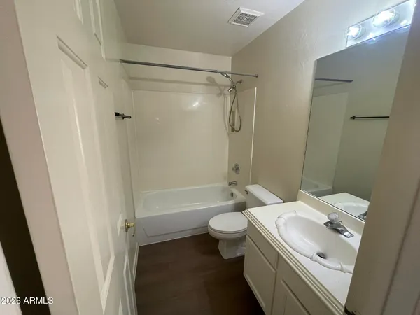 a bathroom with a sink toilet tub and shower