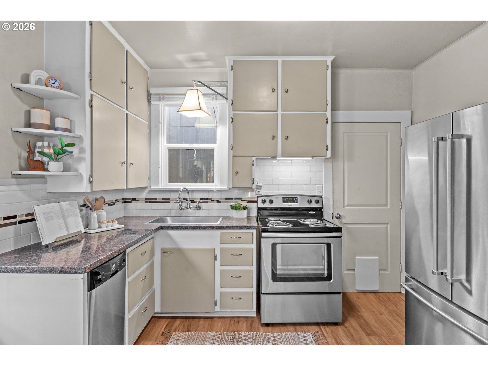 326 Pearl Street Oregon City, OR 97045 - Photo 14 of 36 a kitchen with appliances cabinets and a sink