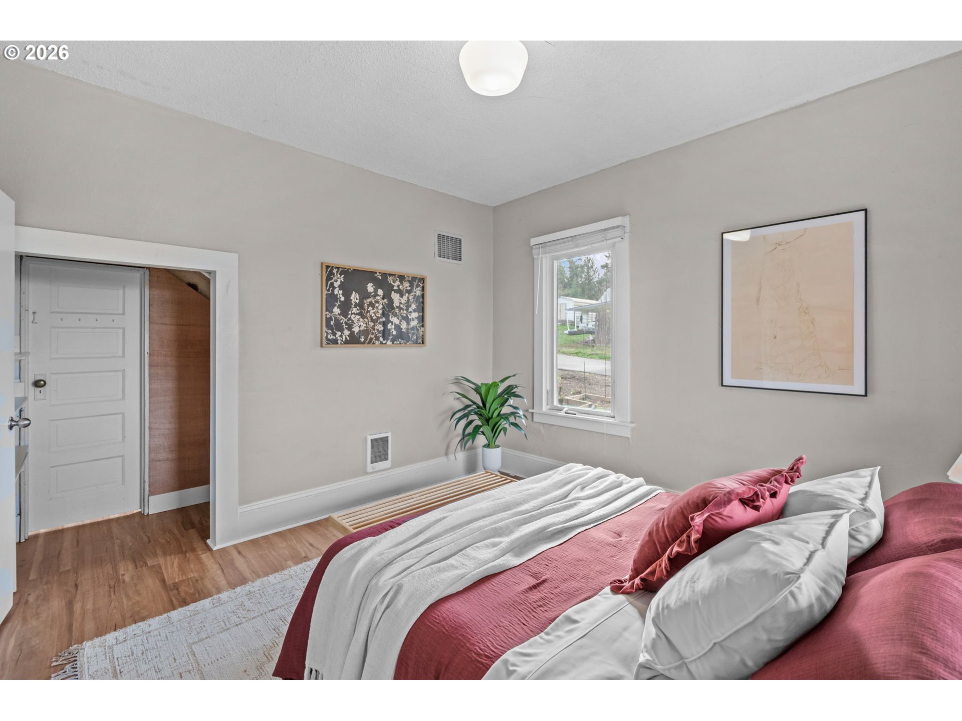 326 Pearl Street Oregon City, OR 97045 - Photo 19 of 36 a bedroom with a bed and wooden floor