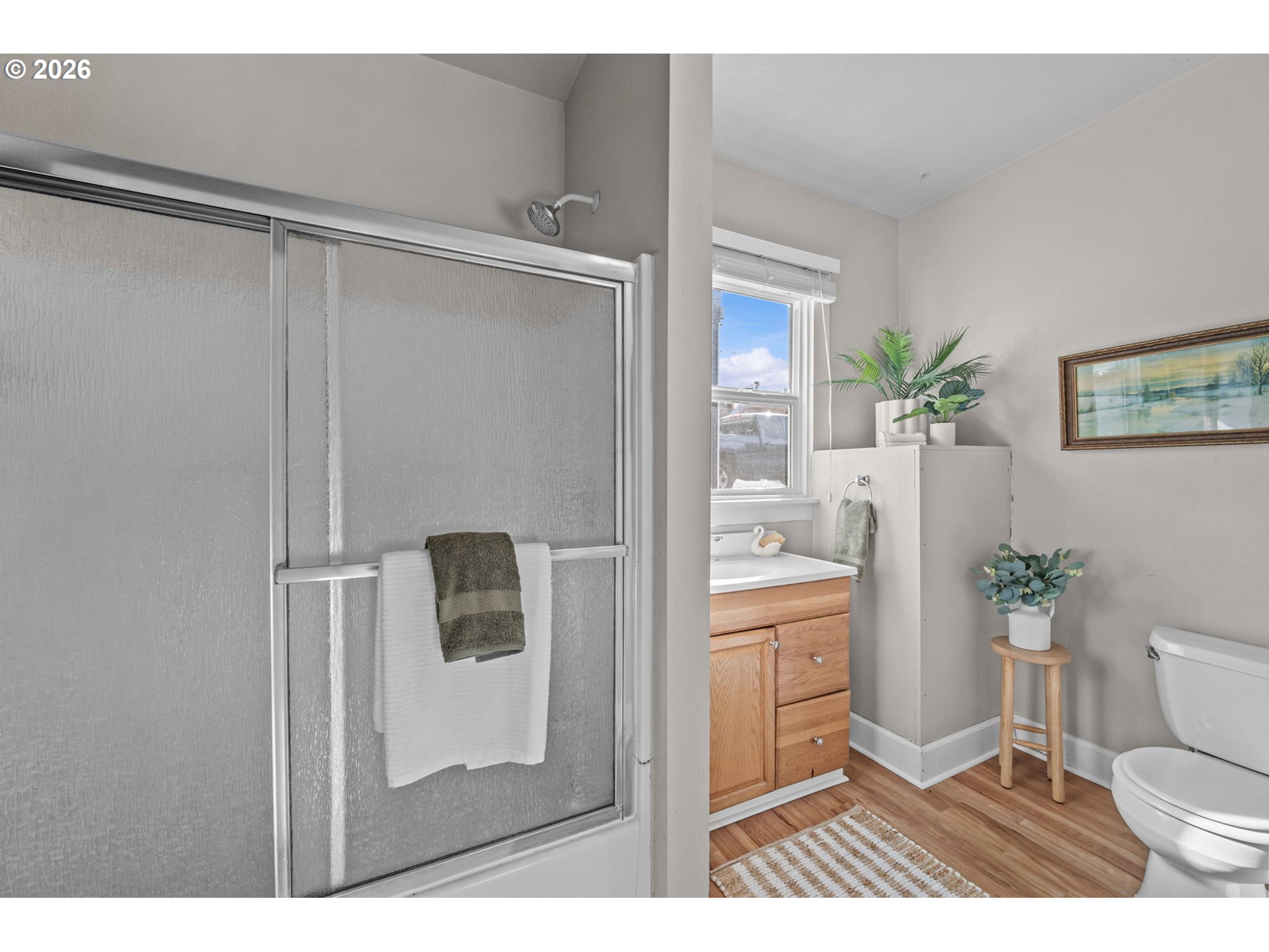 326 Pearl Street Oregon City, OR 97045 - Photo 23 of 36 a bathroom with a shower curtain a sink and a toilet