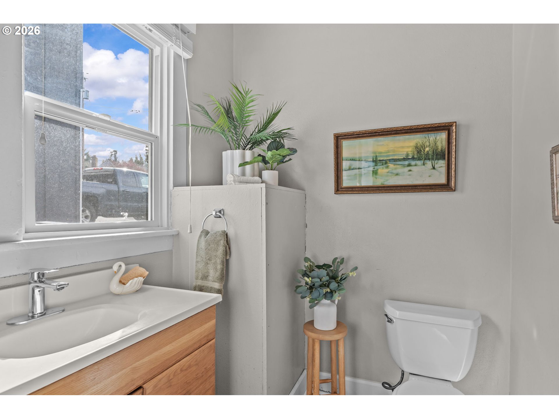 326 Pearl Street Oregon City, OR 97045 - Photo 24 of 36 a bathroom with a granite countertop sink a mirror and a potted plant