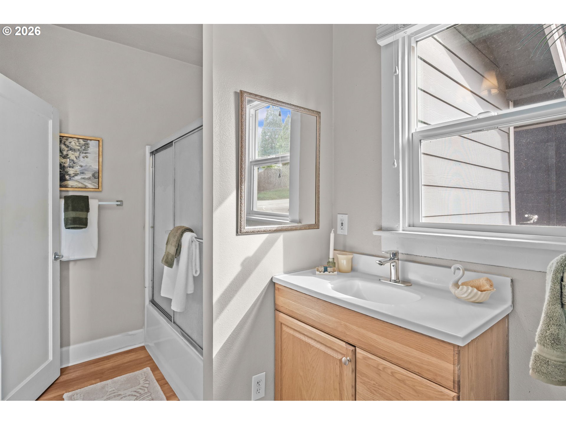 326 Pearl Street Oregon City, OR 97045 - Photo 25 of 36 a bathroom with a sink a mirror and a window