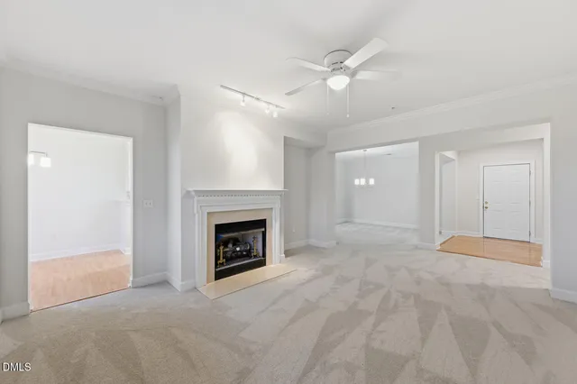 a front view of a residential apartment building with a yard