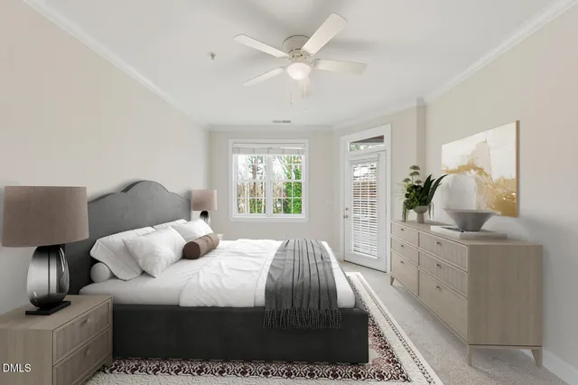 an empty room with a chandelier fan and windows