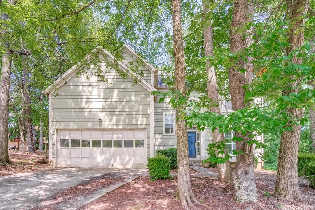 front view of a house with a yard