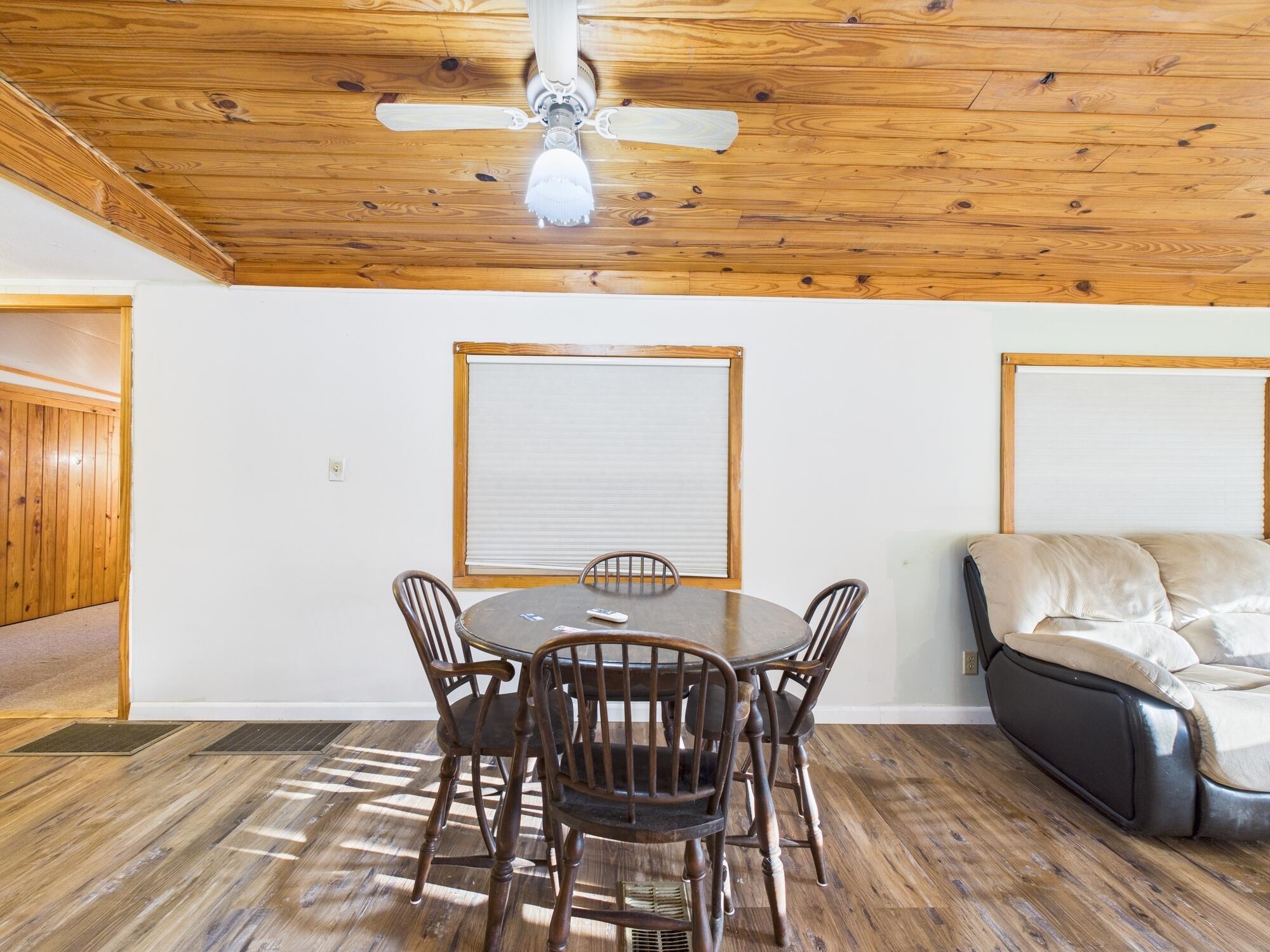 56 Basin Street Lorida, FL 33857 - Photo 17 of 42 a view of a dining room with furniture and wooden floor