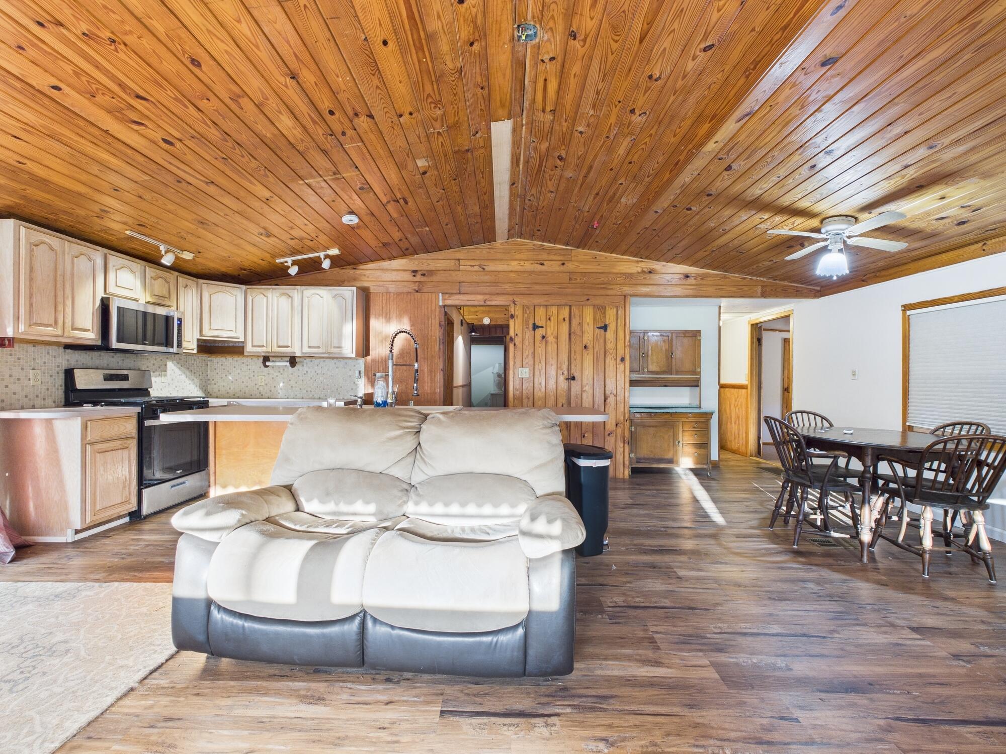 56 Basin Street Lorida, FL 33857 - Photo 10 of 42 a living room with stainless steel appliances kitchen island granite countertop furniture and a kitchen view