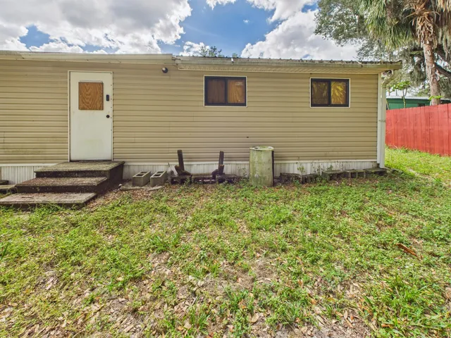 a view of a backyard of the house
